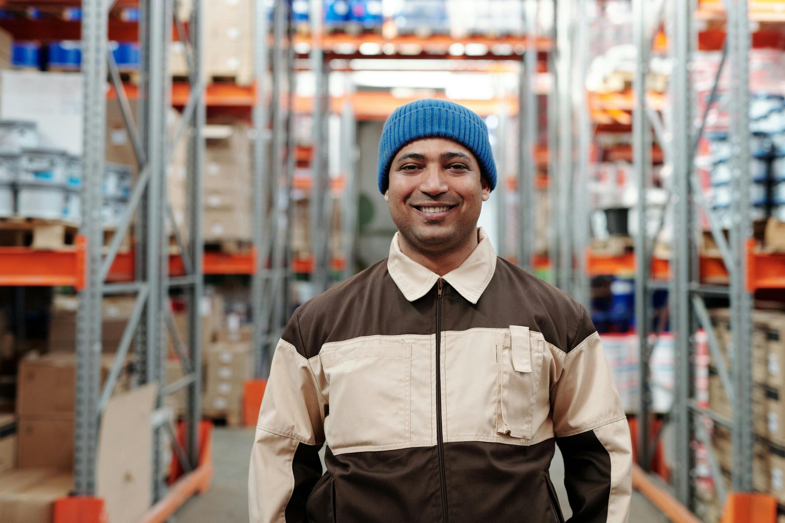 Photo of Man Wearing Blue Beanie Smiling